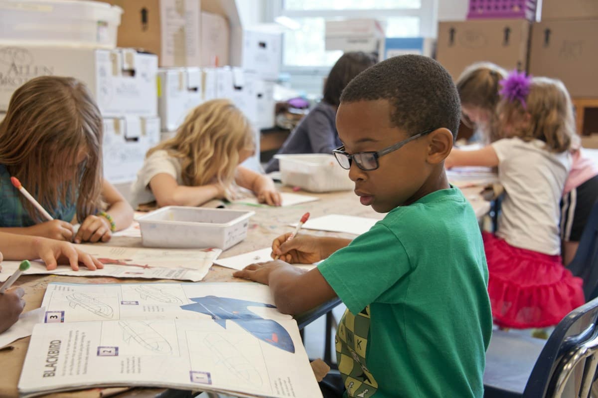 Students building practical computer skills in a classroom